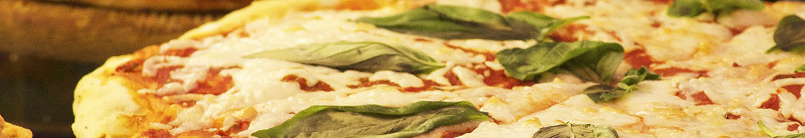 Eating Italian Pizza at Carini's Italian American Grill restaurant in Greensboro, NC.